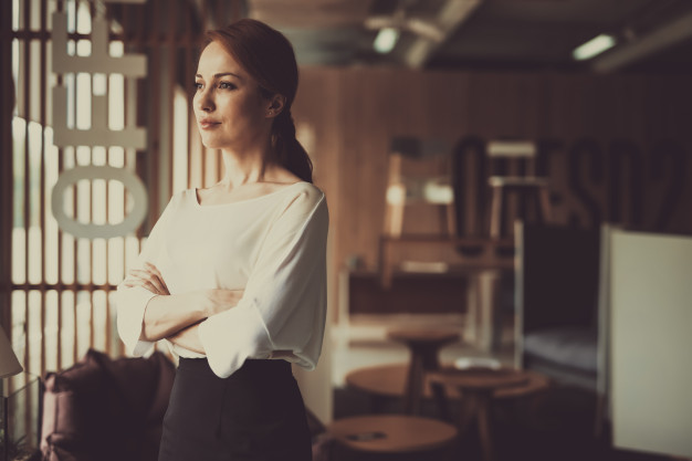 young-woman-is-standing-office-arms-akimbo_99043-3229